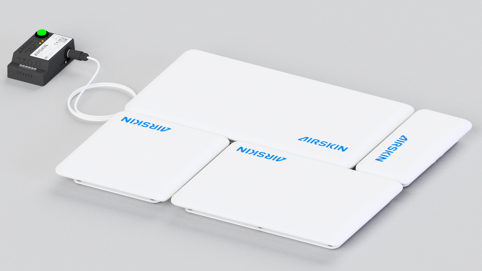 airskin module pads laying on the ground connected to the controller